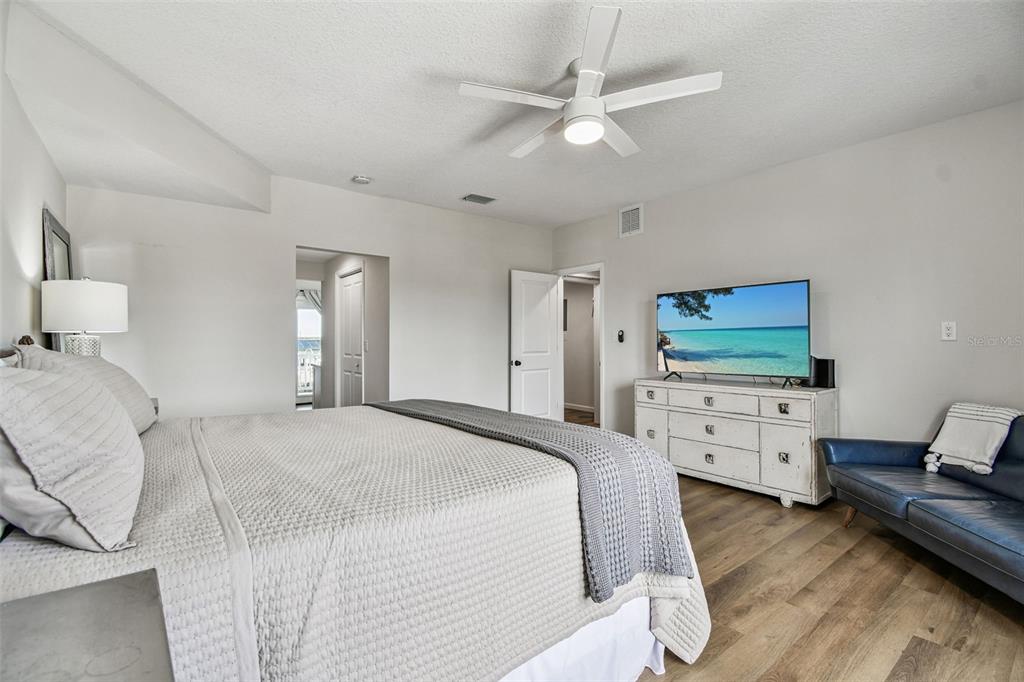 4907 Beacon Road Palmetto, FL 34221 - Photo 26 of 80 a spacious bedroom with a bed and a couch