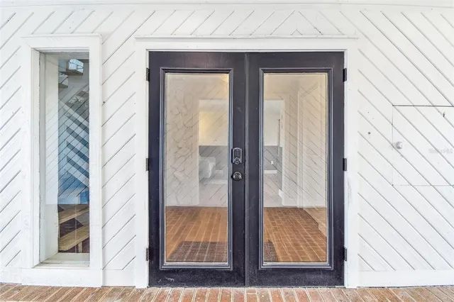 a view of staircase with white walls and a window
