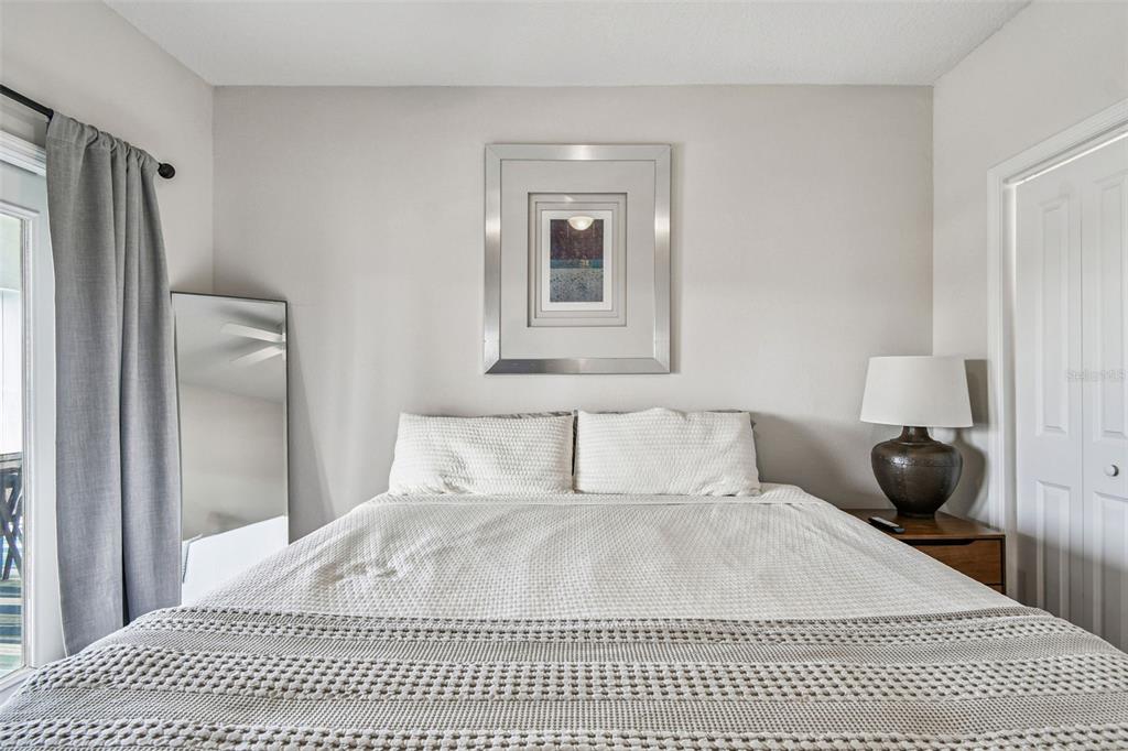 4907 Beacon Road Palmetto, FL 34221 - Photo 31 of 80 a bedroom with a bed a window and walk in closet