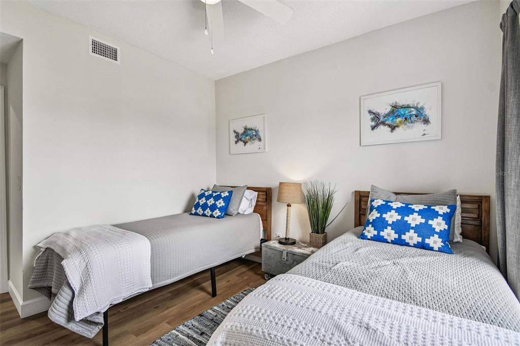 4907 Beacon Road Palmetto, FL 34221 - Photo 35 of 80 a bedroom with bed and a couch