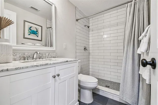 a view of a patio with table and chairs with wooden floor and fence
