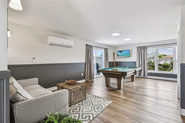 a view of an house with swimming pool and sitting area