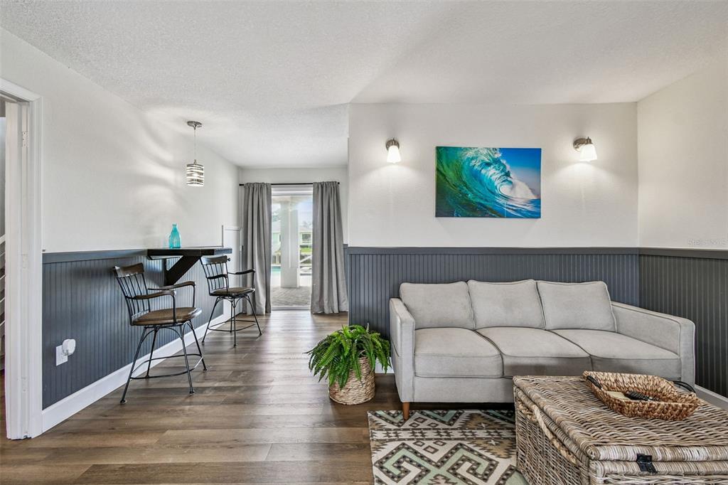 4907 Beacon Road Palmetto, FL 34221 - Photo 40 of 80 a living room with furniture and wooden floor