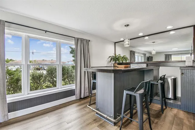 a view of a swimming pool with a table and chairs