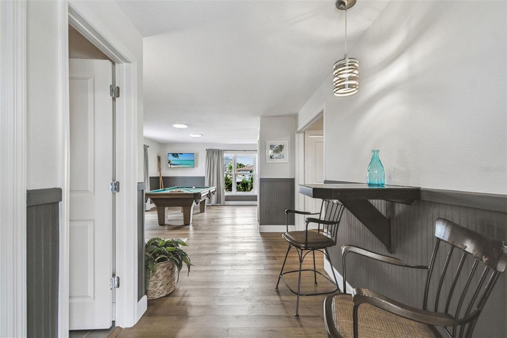 4907 Beacon Road Palmetto, FL 34221 - Photo 43 of 80 a view of a dining room with furniture and wooden floor