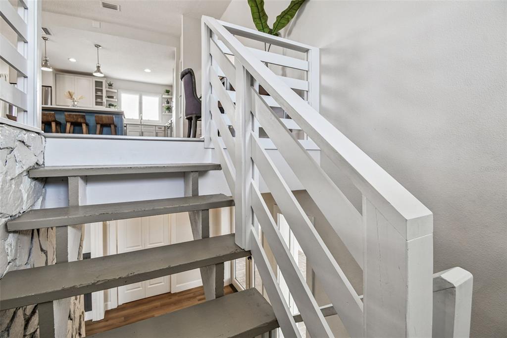 4907 Beacon Road Palmetto, FL 34221 - Photo 5 of 80 a view of staircase with white walls and a window