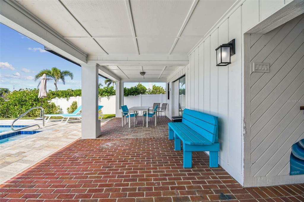 4907 Beacon Road Palmetto, FL 34221 - Photo 52 of 80 a view of a porch with furniture and a yard