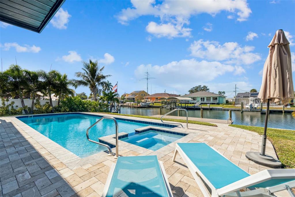4907 Beacon Road Palmetto, FL 34221 - Photo 64 of 80 a view of a swimming pool with a lounge chair