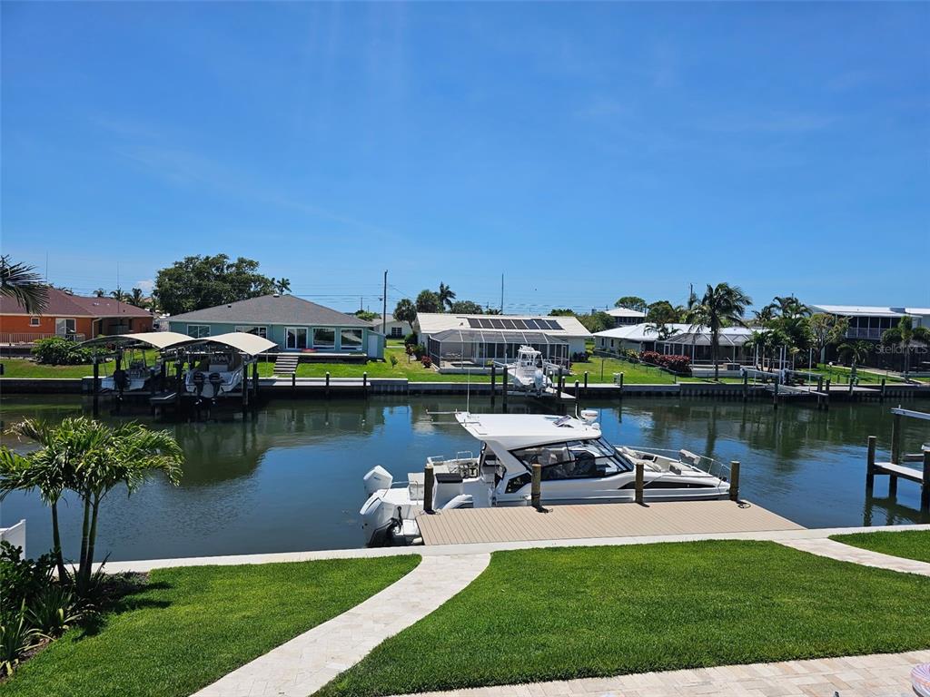 4907 Beacon Road Palmetto, FL 34221 - Photo 72 of 80 a view of a lake with houses with outdoor space