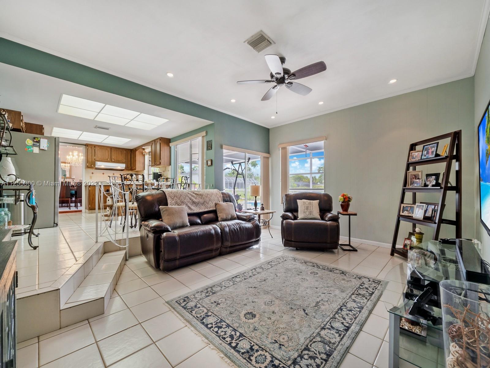 7001 Southwest 126th Street Pinecrest, FL 33156 - Photo 14 of 19 a living room with furniture and wooden floor
