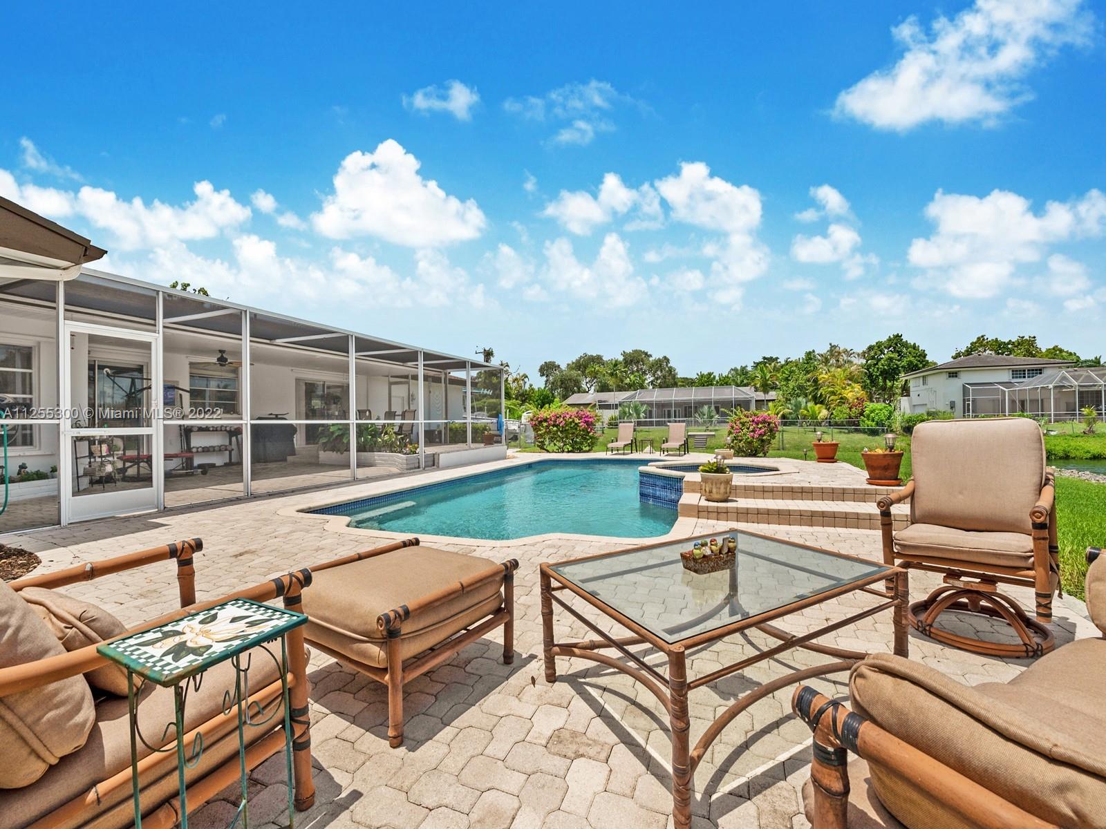 7001 Southwest 126th Street Pinecrest, FL 33156 - Photo 15 of 19 a view of a terrace with furniture