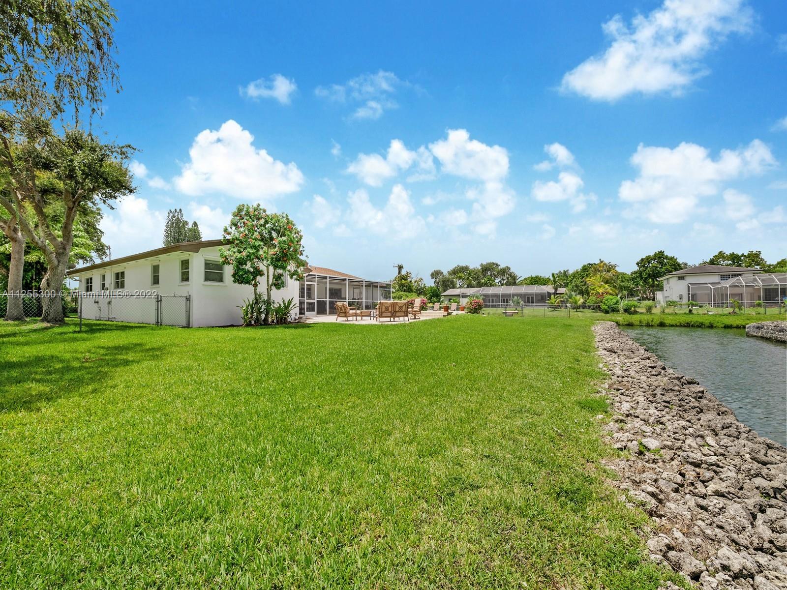 7001 Southwest 126th Street Pinecrest, FL 33156 - Photo 16 of 19 a view of a house with a yard