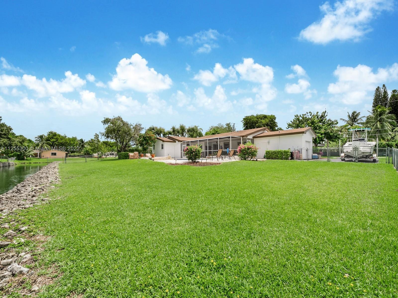 7001 Southwest 126th Street Pinecrest, FL 33156 - Photo 17 of 19 a view of a house with a big yard