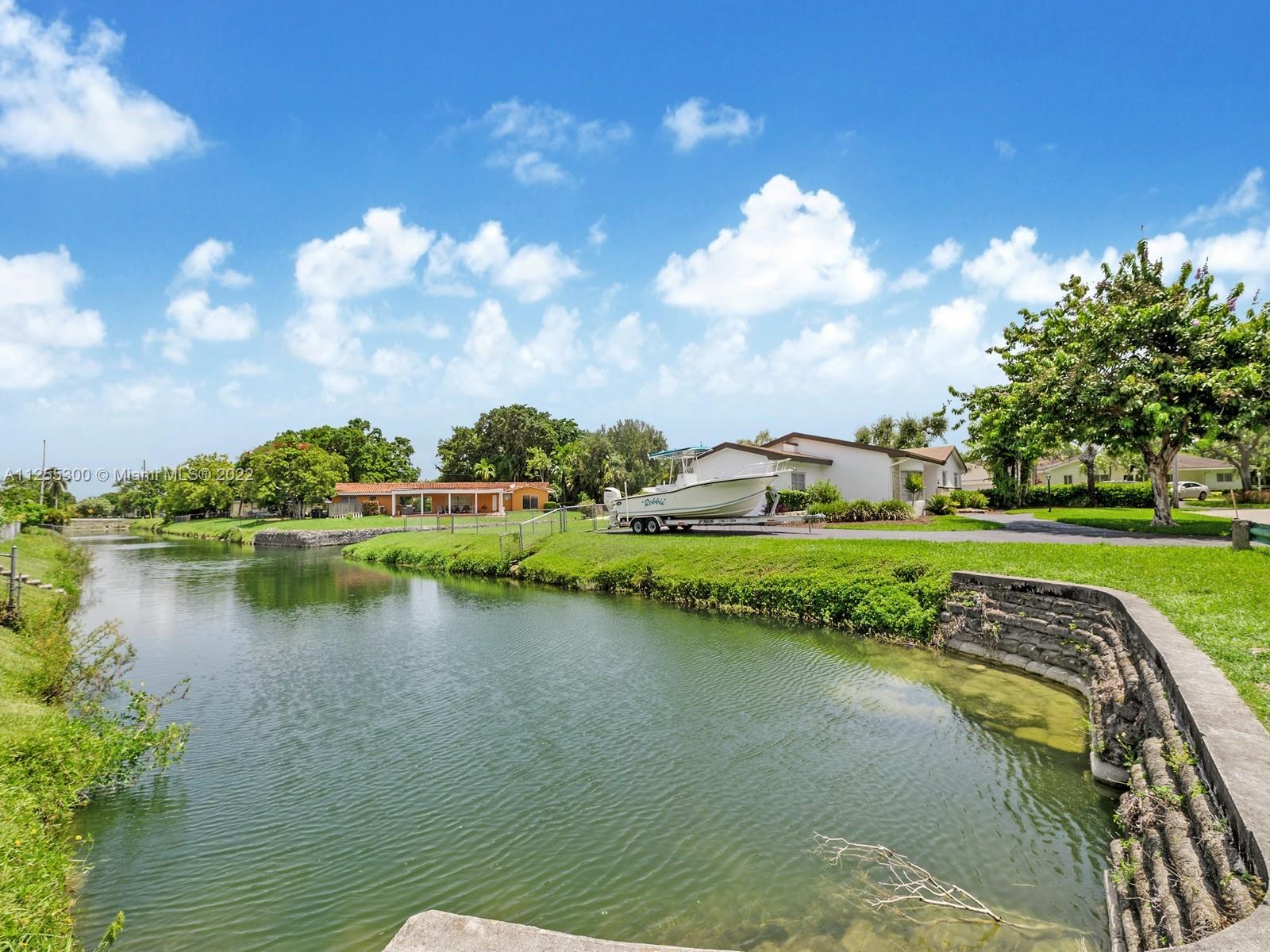 7001 Southwest 126th Street Pinecrest, FL 33156 - Photo 18 of 19 a view of a lake with a yard