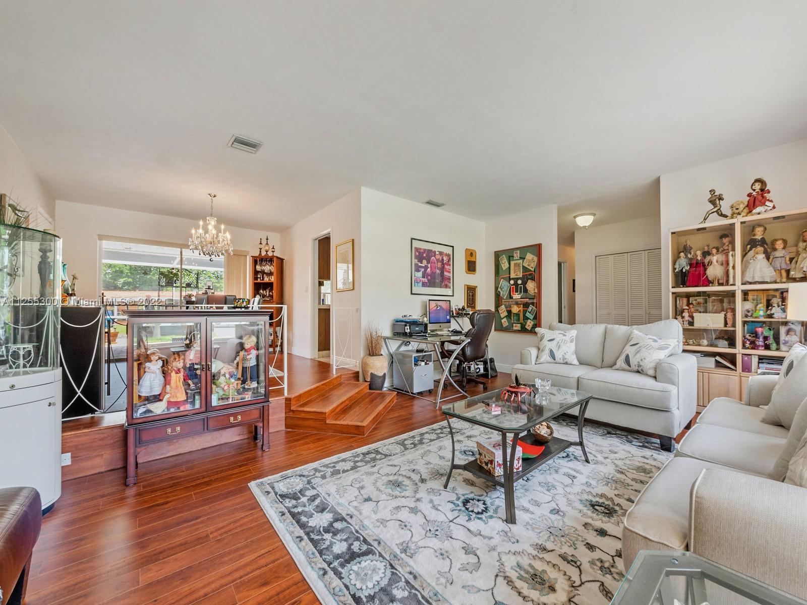 7001 Southwest 126th Street Pinecrest, FL 33156 - Photo 4 of 19 a living room with furniture and wooden floor