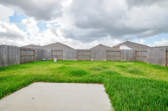 a view of a front of house with yard and green space