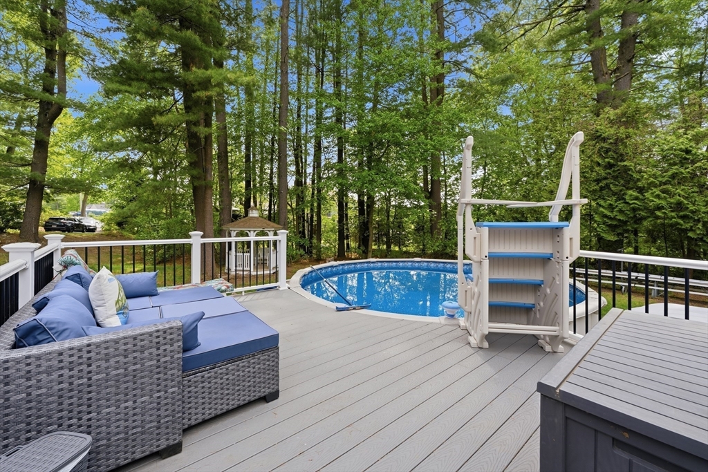 43 Flint Road Tyngsborough, MA 01879 - Photo 32 of 40 a view of a roof deck with wooden floor and fence