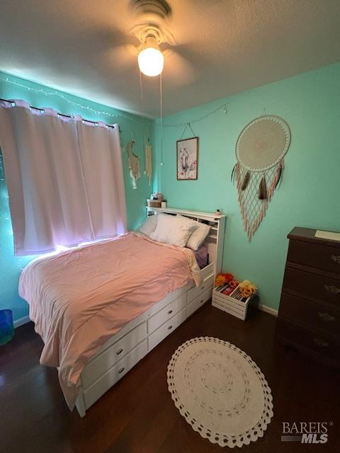 729 Christensen Way Rio Vista, CA 94571 - Photo 12 of 21 a large bed sitting in a bedroom next to a window and a chandelier