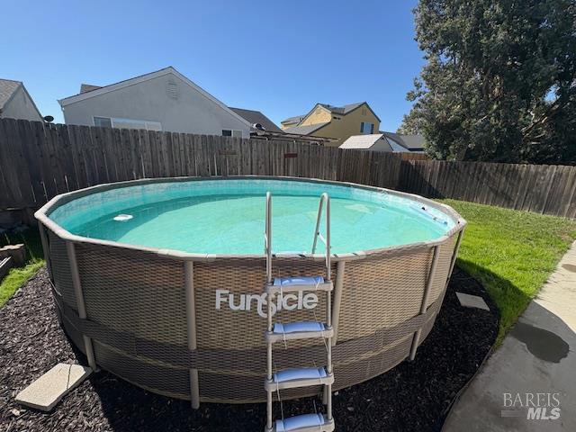 729 Christensen Way Rio Vista, CA 94571 - Photo 21 of 21 a blue and white umbrella sitting in a backyard