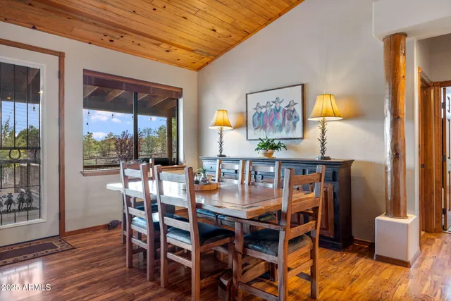 a dining room with furniture and window
