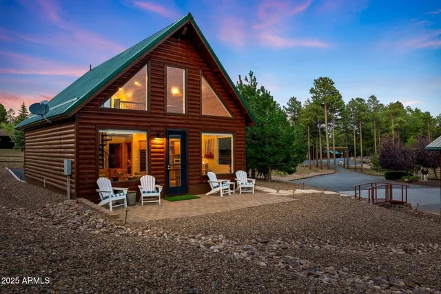 a group of table and chairs in a patio