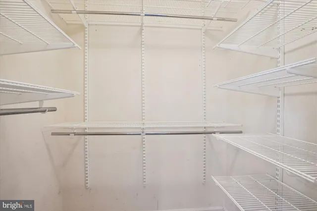 a view of a bathroom with a granite countertop shower and a sink