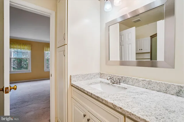 a view of a balcony with wooden floor and iron stairs
