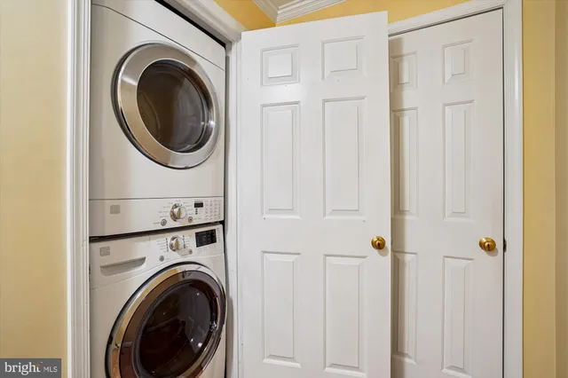 a view of a hallway with washer and dryer