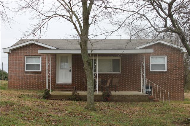 1202 Rutledge Ford Road Decherd, TN 37324 - Photo 1 of 11 a house that has a tree in front of the house