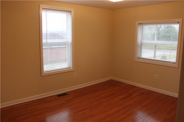 1202 Rutledge Ford Road Decherd, TN 37324 - Photo 5 of 11 an empty room with wooden floor and windows