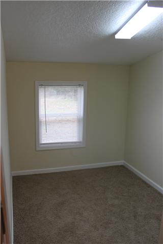 1202 Rutledge Ford Road Decherd, TN 37324 - Photo 7 of 11 an empty room with a window