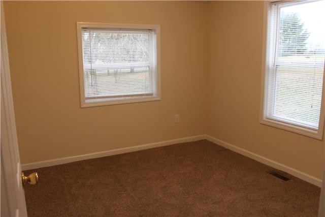 1202 Rutledge Ford Road Decherd, TN 37324 - Photo 8 of 11 an empty room with a window