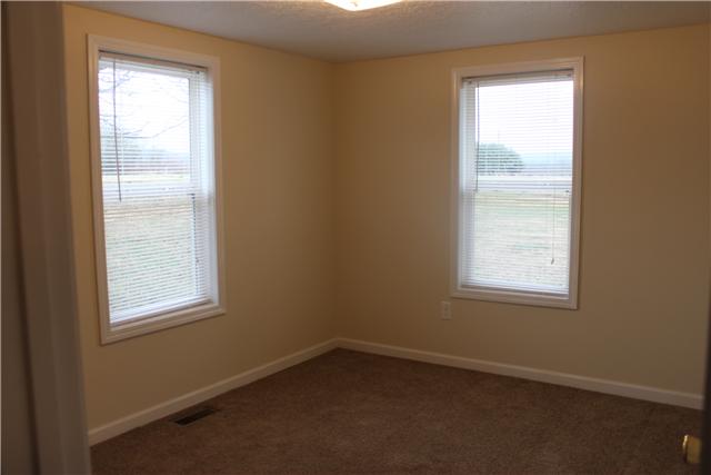 1202 Rutledge Ford Road Decherd, TN 37324 - Photo 9 of 11 an empty room with a window