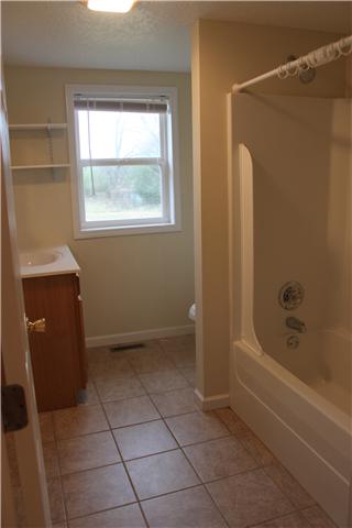 1202 Rutledge Ford Road Decherd, TN 37324 - Photo 10 of 11 a bathroom with a bathtub