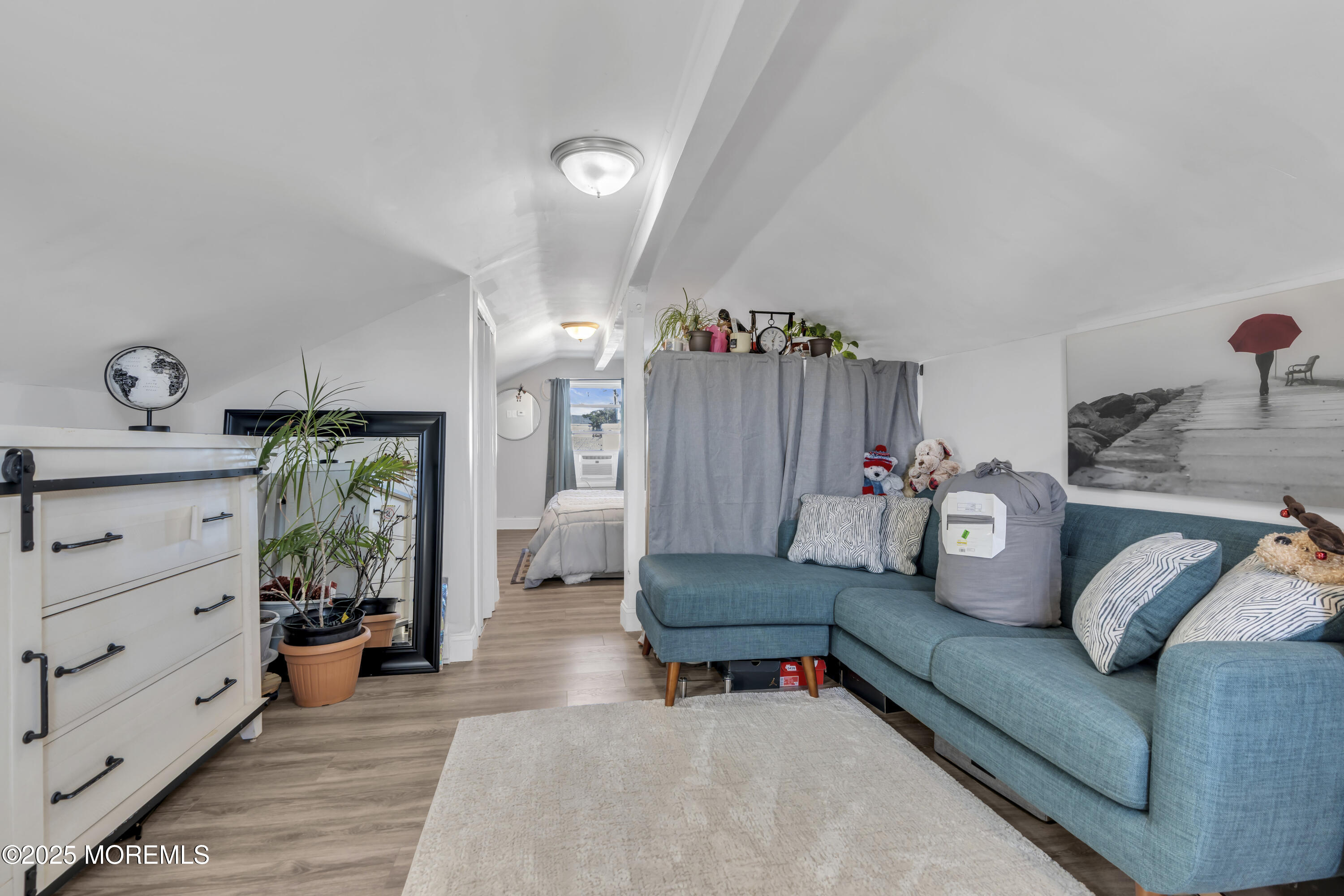 934 7th Street Union Beach, NJ 07735 - Photo 16 of 50 a living room with furniture and a chandelier