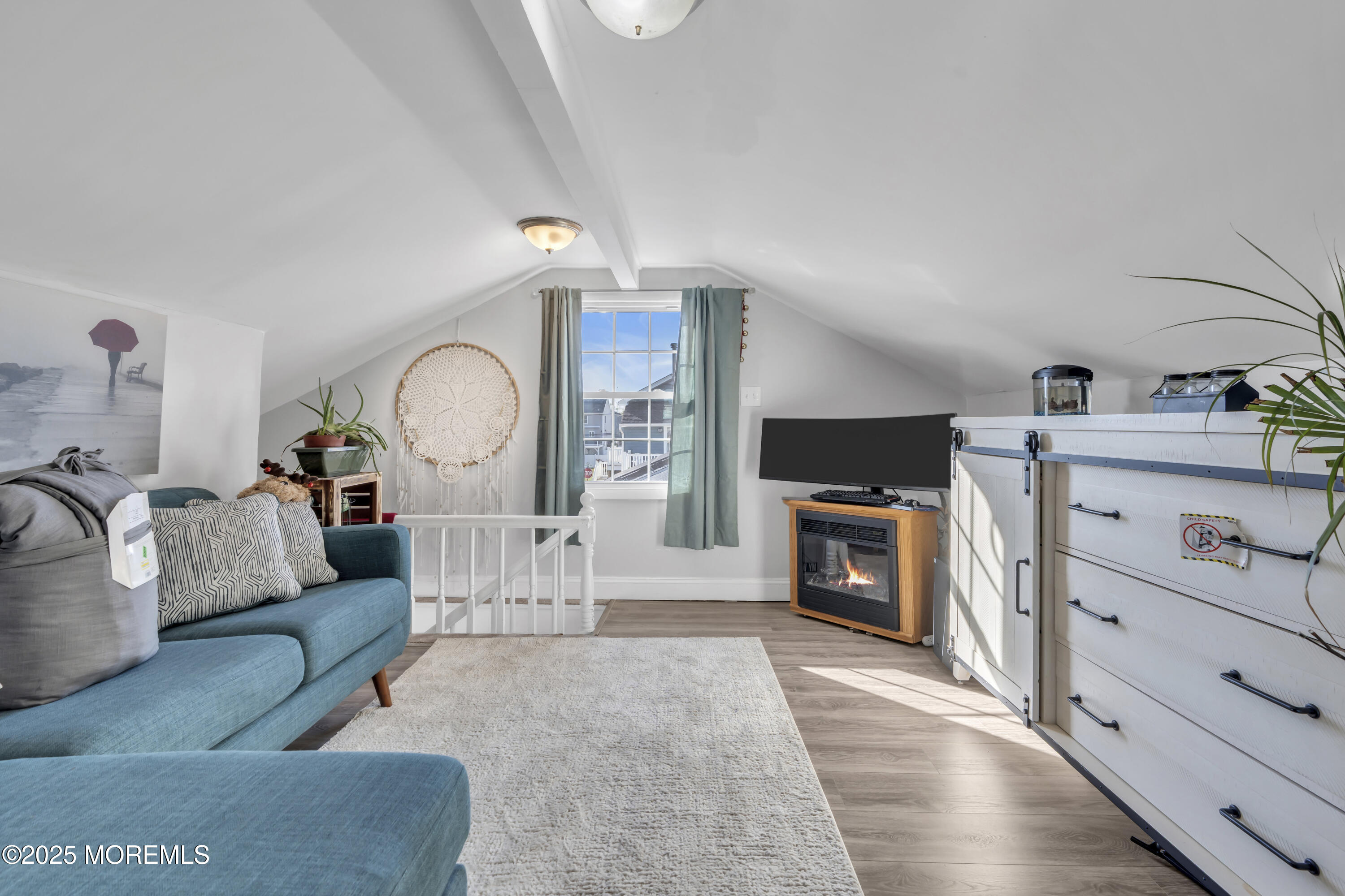 934 7th Street Union Beach, NJ 07735 - Photo 17 of 50 a living room with furniture fireplace and flat screen tv