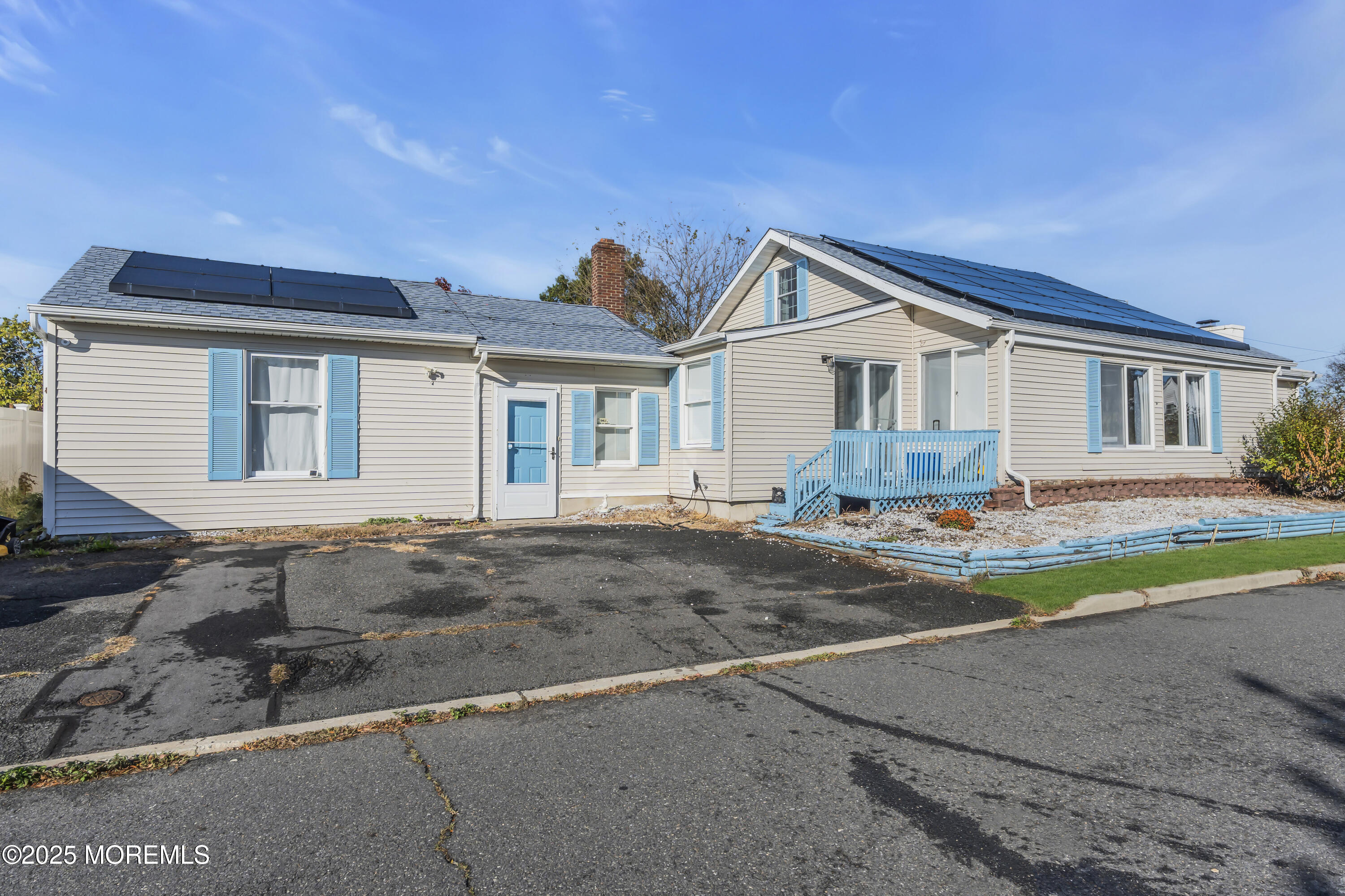 934 7th Street Union Beach, NJ 07735 - Photo 2 of 50 a front view of a house with a yard