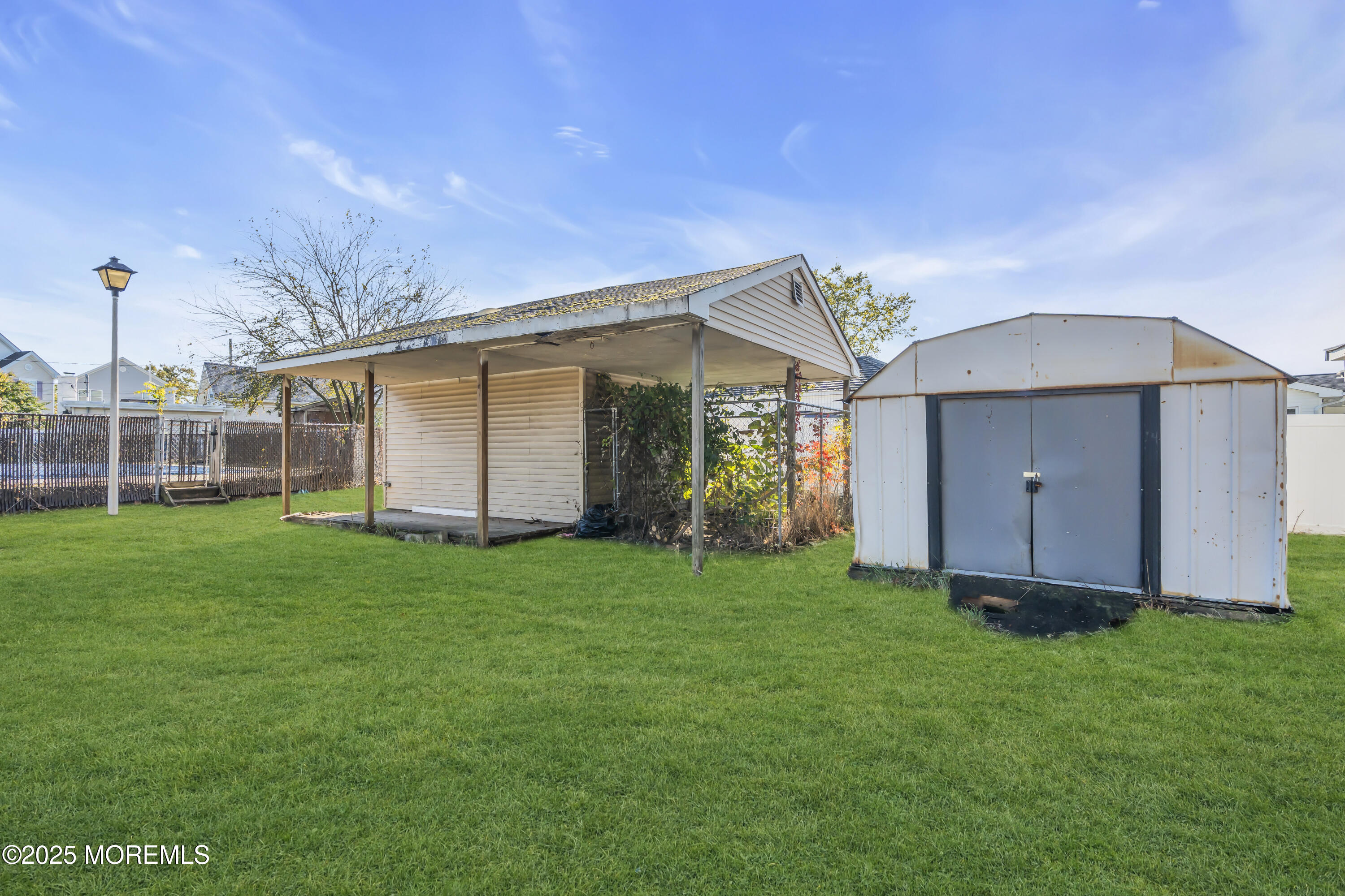 934 7th Street Union Beach, NJ 07735 - Photo 23 of 50 a view of a back yard of the house
