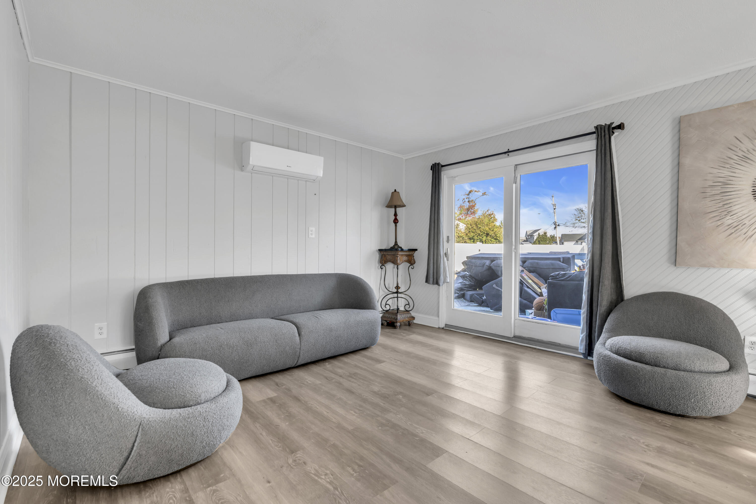 934 7th Street Union Beach, NJ 07735 - Photo 28 of 50 a living room with furniture and a large window