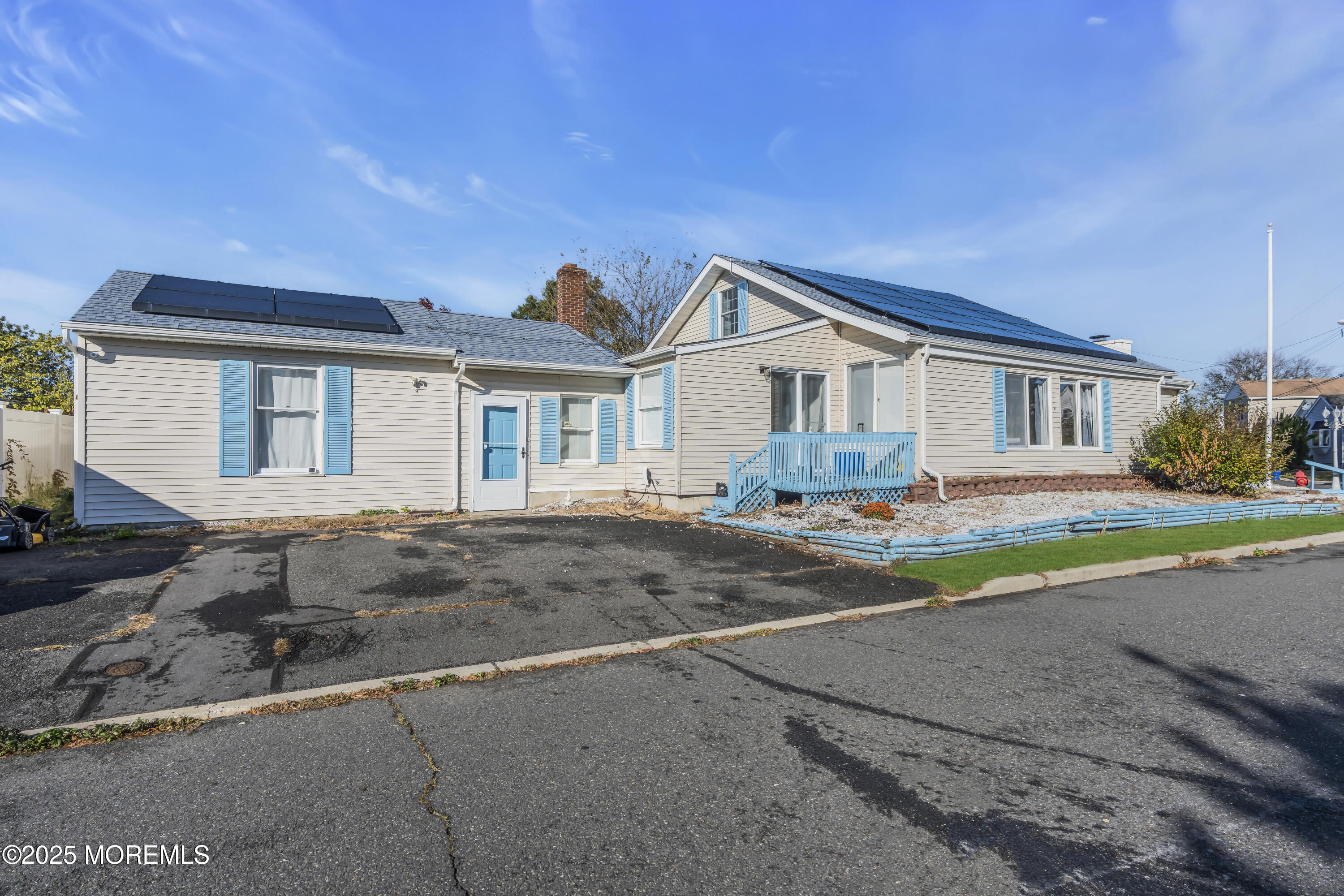 934 7th Street Union Beach, NJ 07735 - Photo 41 of 50 a front view of a house with a yard and garage