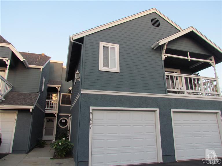 1818 Rory Lane, Unit 2 Simi Valley, CA 93063 - Photo 1 of 13 a front view of a house with garage