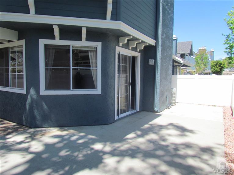 1818 Rory Lane, Unit 2 Simi Valley, CA 93063 - Photo 11 of 13 a view of a house with a backyard