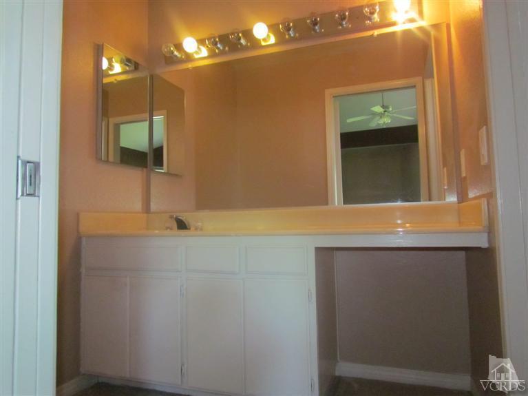 1818 Rory Lane, Unit 2 Simi Valley, CA 93063 - Photo 6 of 13 a bathroom with a sink and a mirror