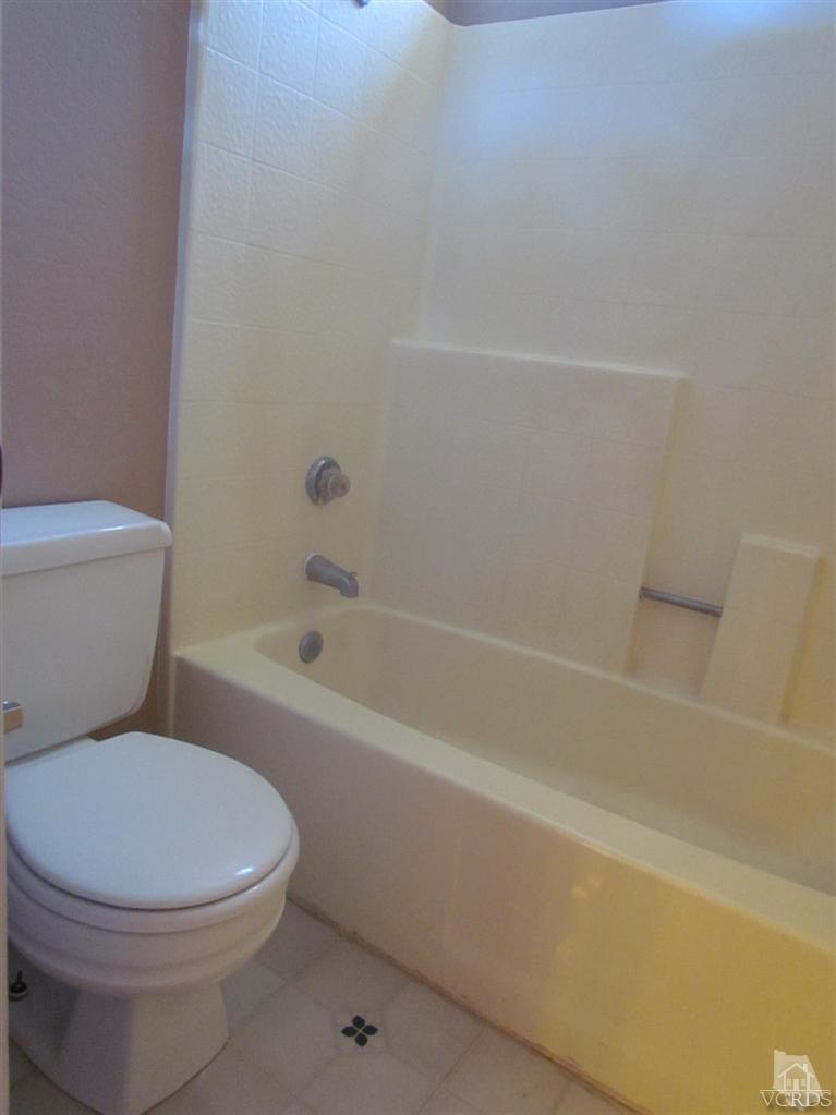 1818 Rory Lane, Unit 2 Simi Valley, CA 93063 - Photo 7 of 13 a white toilet sitting next to a bath tub