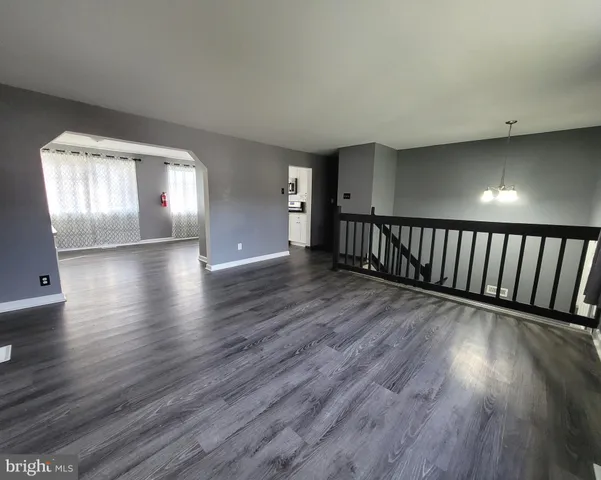 a view of gallery with wooden floor