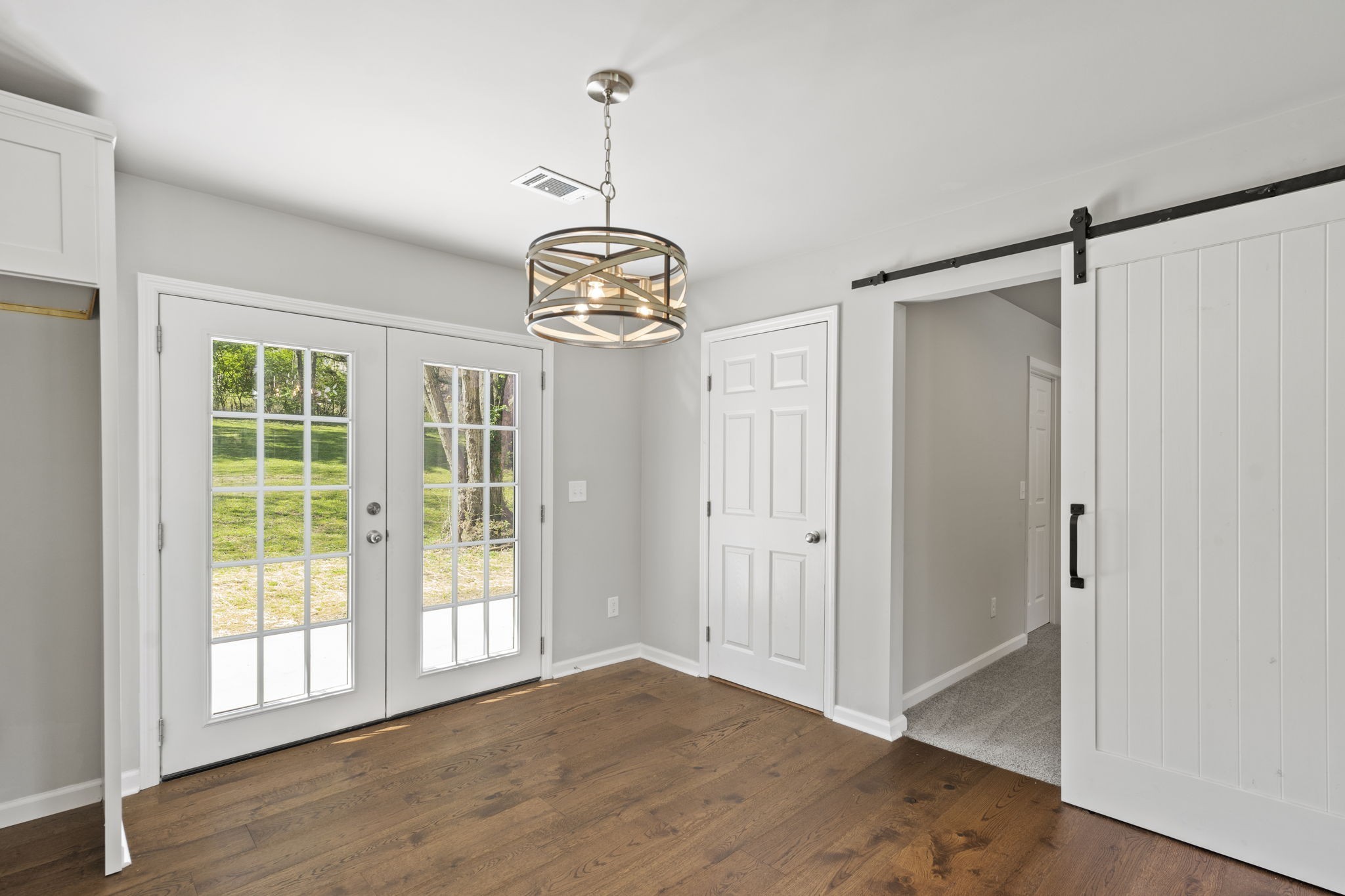 128 South Valley Road Hendersonville, TN 37075 - Photo 11 of 30 a view of an empty room with wooden floor and a window