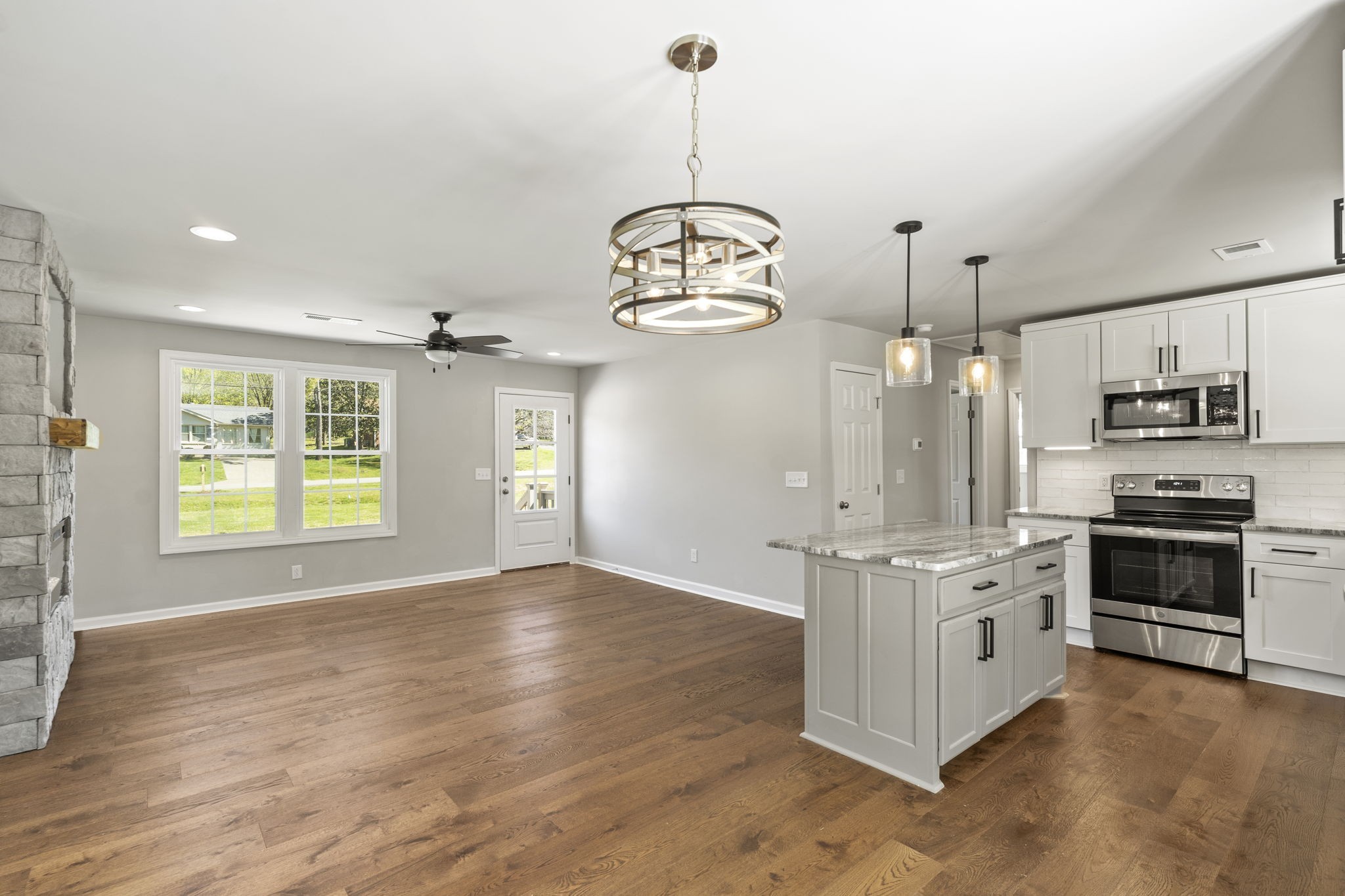 128 South Valley Road Hendersonville, TN 37075 - Photo 12 of 30 a kitchen with stainless steel appliances granite countertop a stove oven and a sink