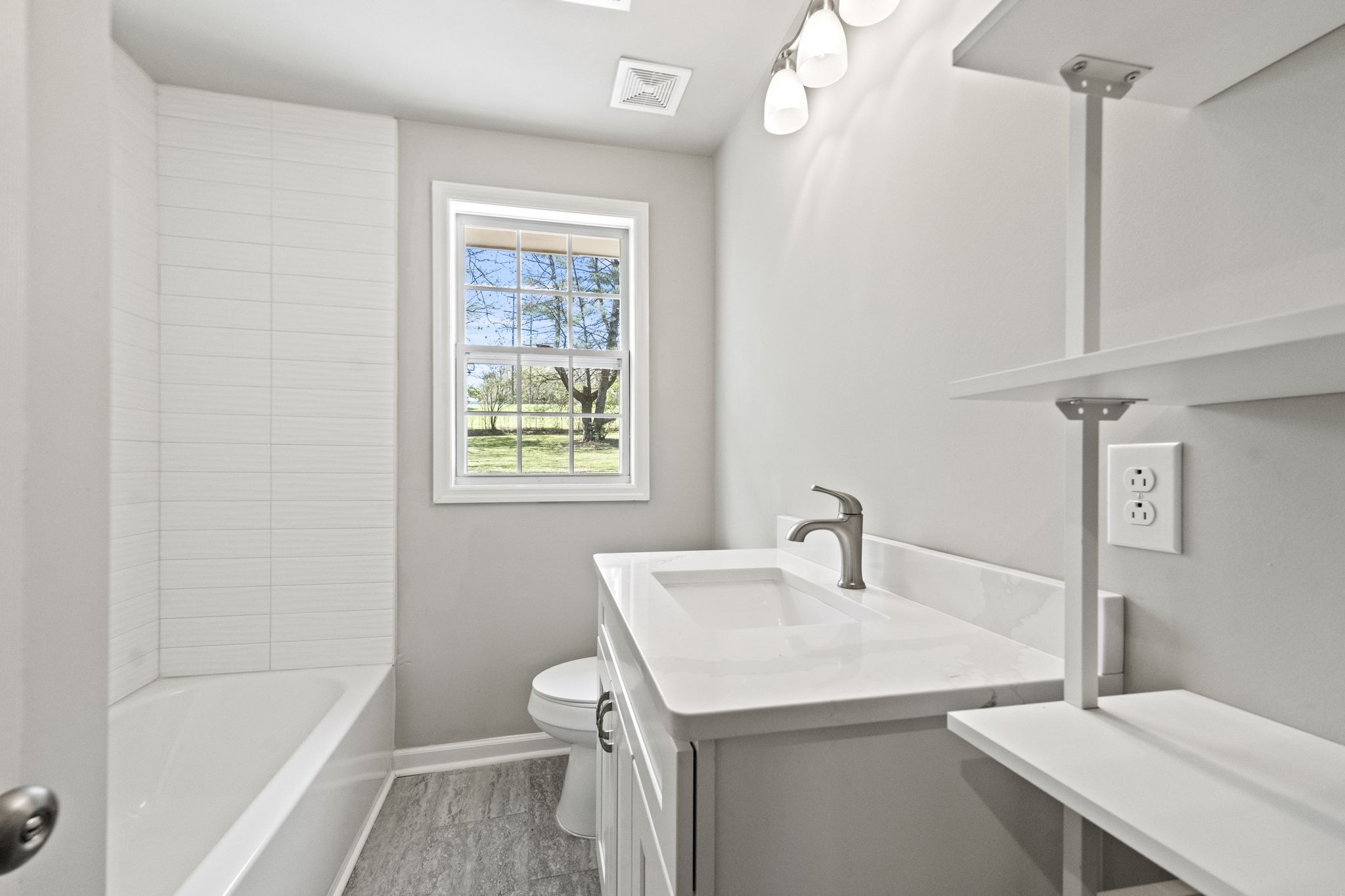 128 South Valley Road Hendersonville, TN 37075 - Photo 17 of 30 a bathroom with a sink a toilet and shower