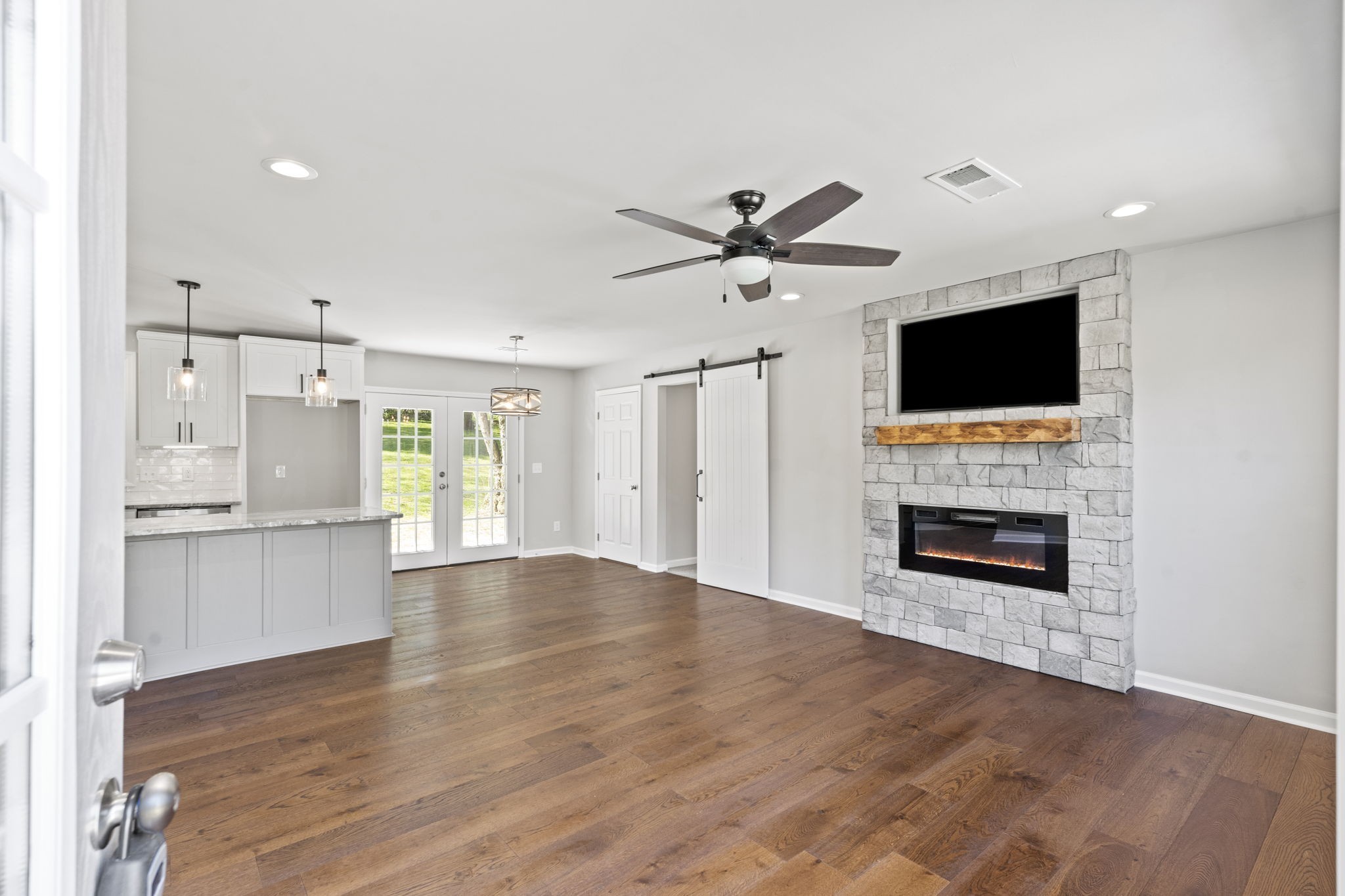 128 South Valley Road Hendersonville, TN 37075 - Photo 6 of 30 a view of a livingroom with a fireplace a sink and a kitchen counter top space