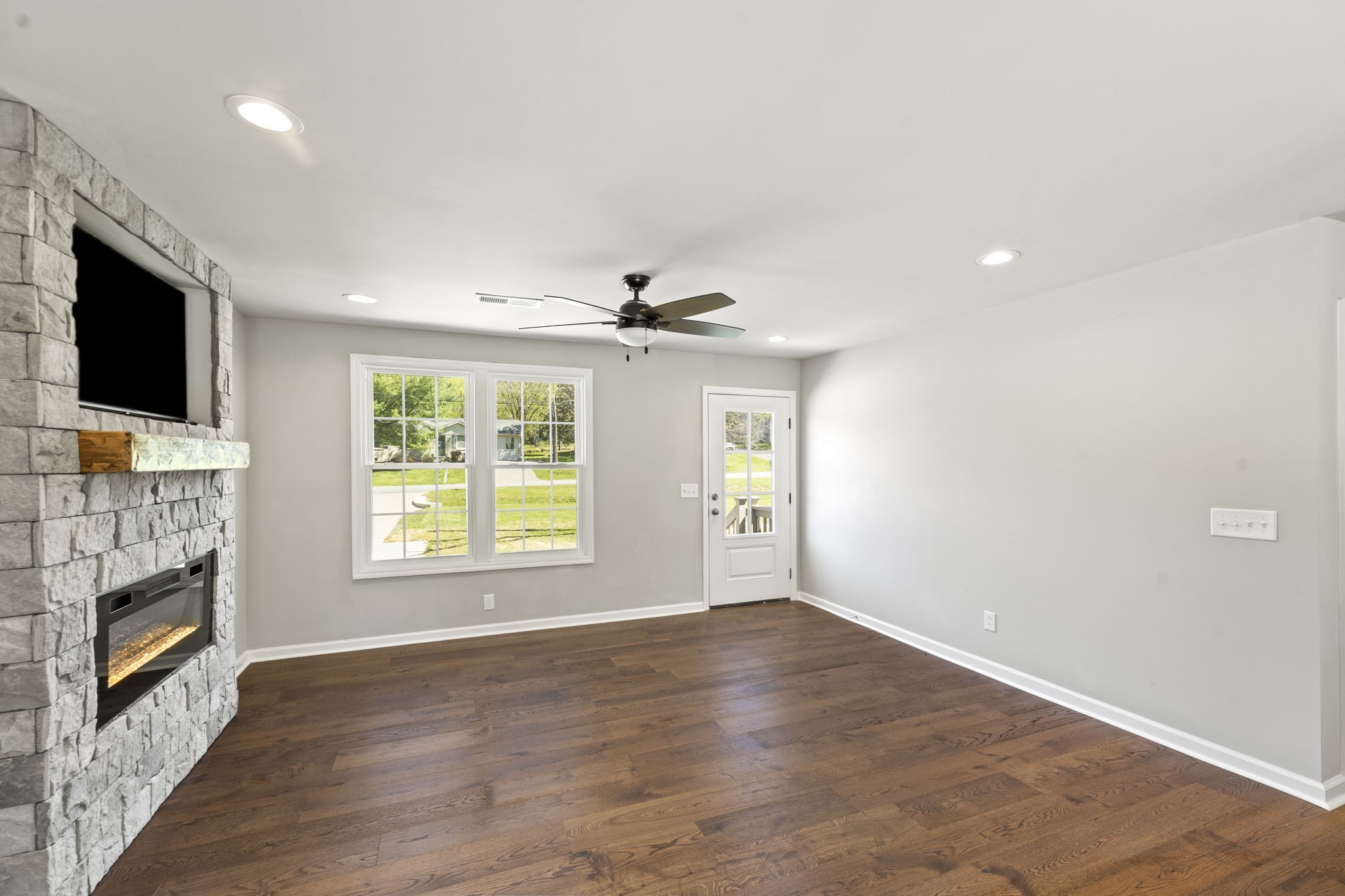 128 South Valley Road Hendersonville, TN 37075 - Photo 7 of 30 a view of an empty room with a fireplace and a window